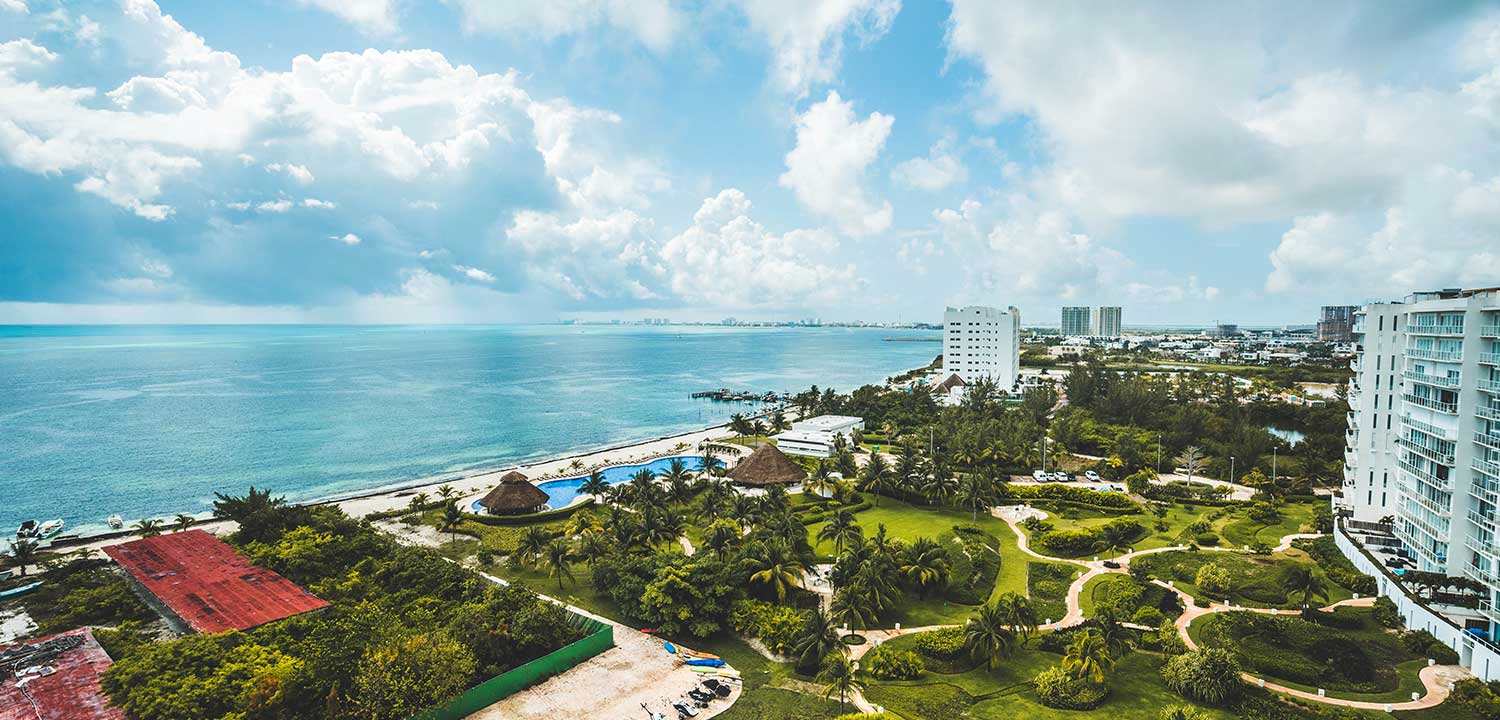 mexico_cancun Cancun Resort with pool and beach coast line.